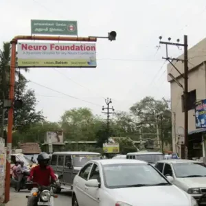 Neuro Foundation Signal Board on Crowded Street with Traffic