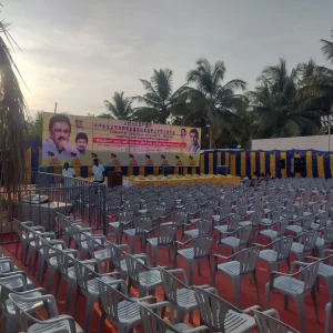 Stage with custom political flex banner and backdrop setup for public event