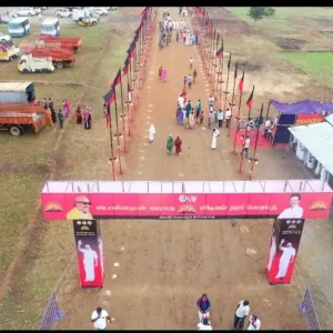 Flex-printed political entrance arch for public gathering and party event with crowd and flag decorations