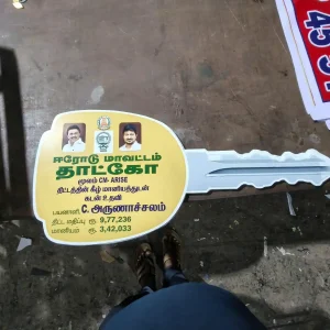 Custom key-shaped image cutout with political branding and text