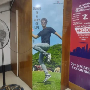 Volume Zero Denim Poster on Ready-Made Indoor Board at Fitting Room Entrance