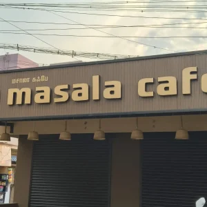 Elegant 'Masala Café' name board with modern font and logo
